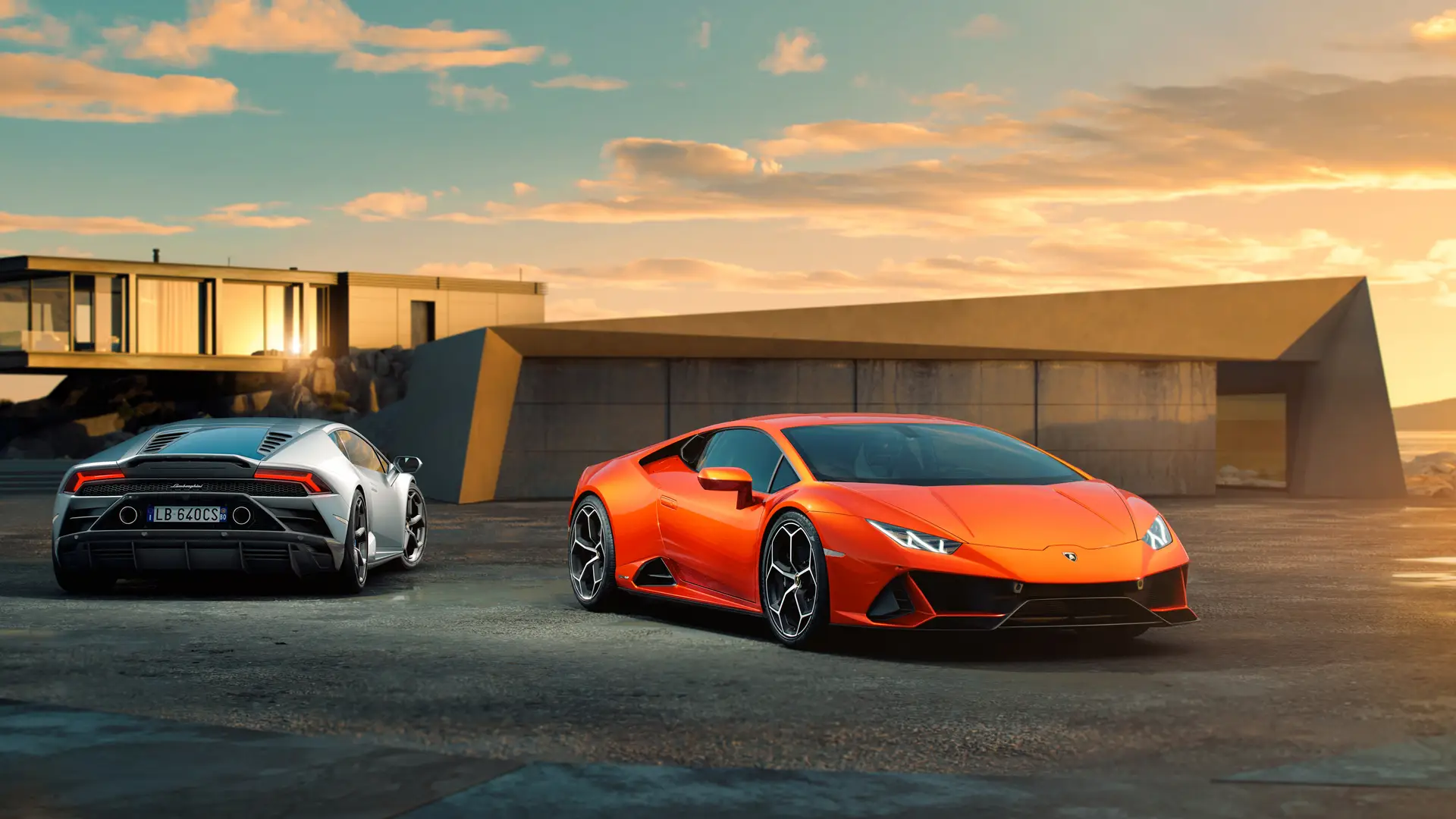 Luxury Sports Cars at Sunset with Modern Architecture